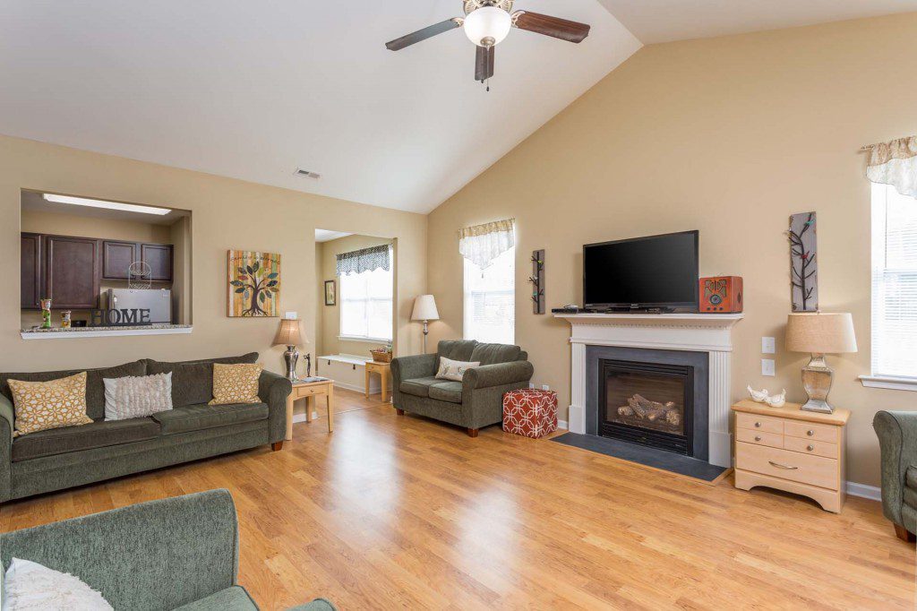 Spacious living room at Avendelle at Lazy River with a fireplace and comfortable seating