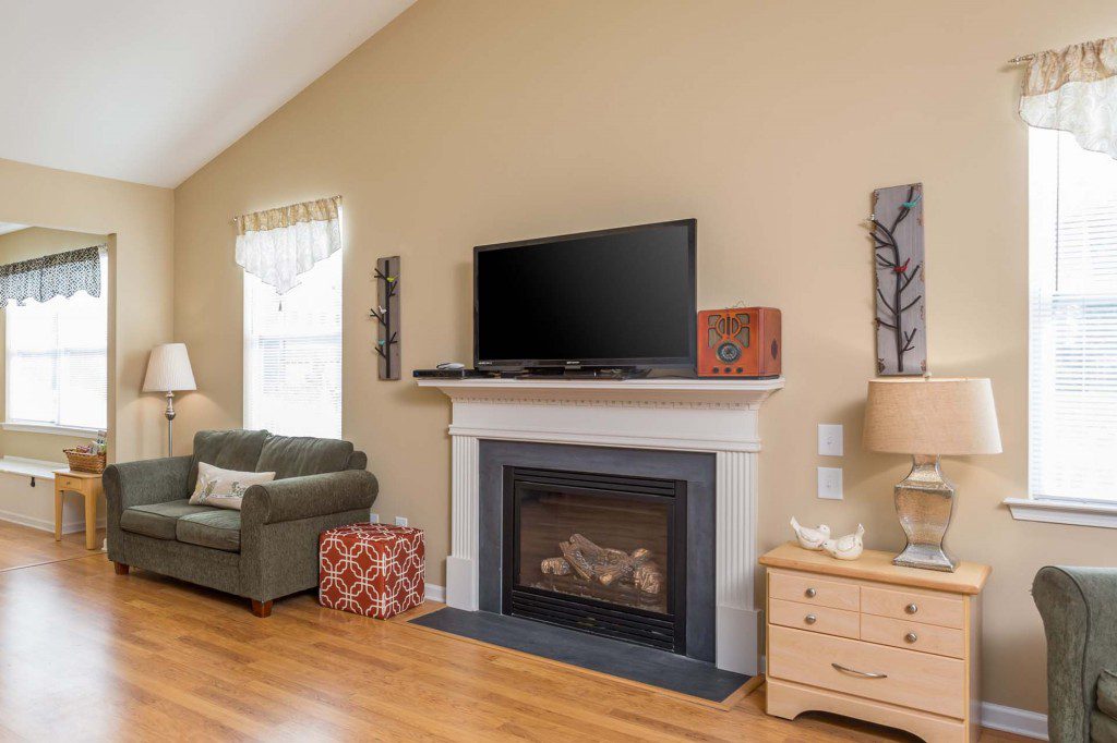 Living room fireplace and seating area at Avendelle at Lazy River