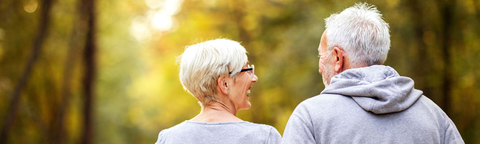 Mature Couple Man And Woman Jogging In The Park